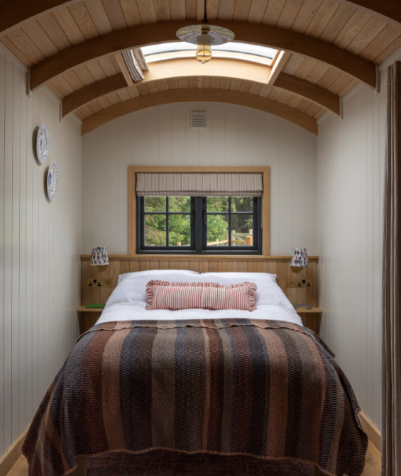 A double bed under the eaves, a small kitchenette, a firepit outside the door, nothing more than you need, and nothing less than beautiful.